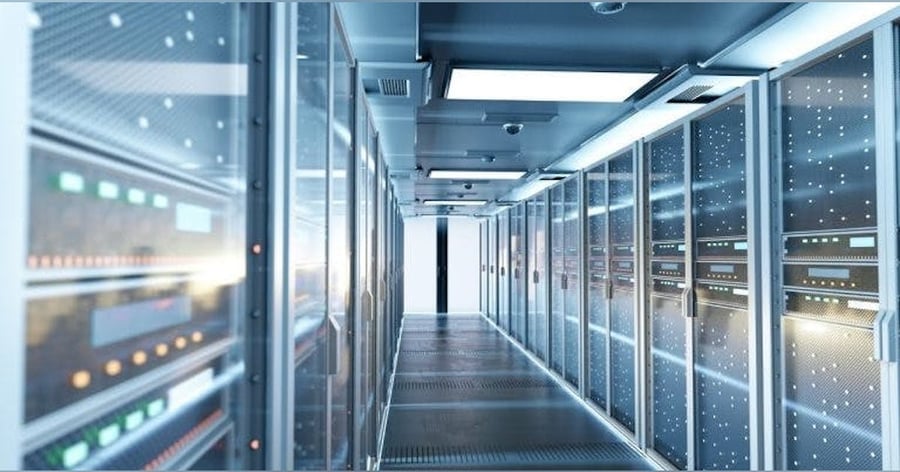 A modern, brightly lit data center hallway with server racks