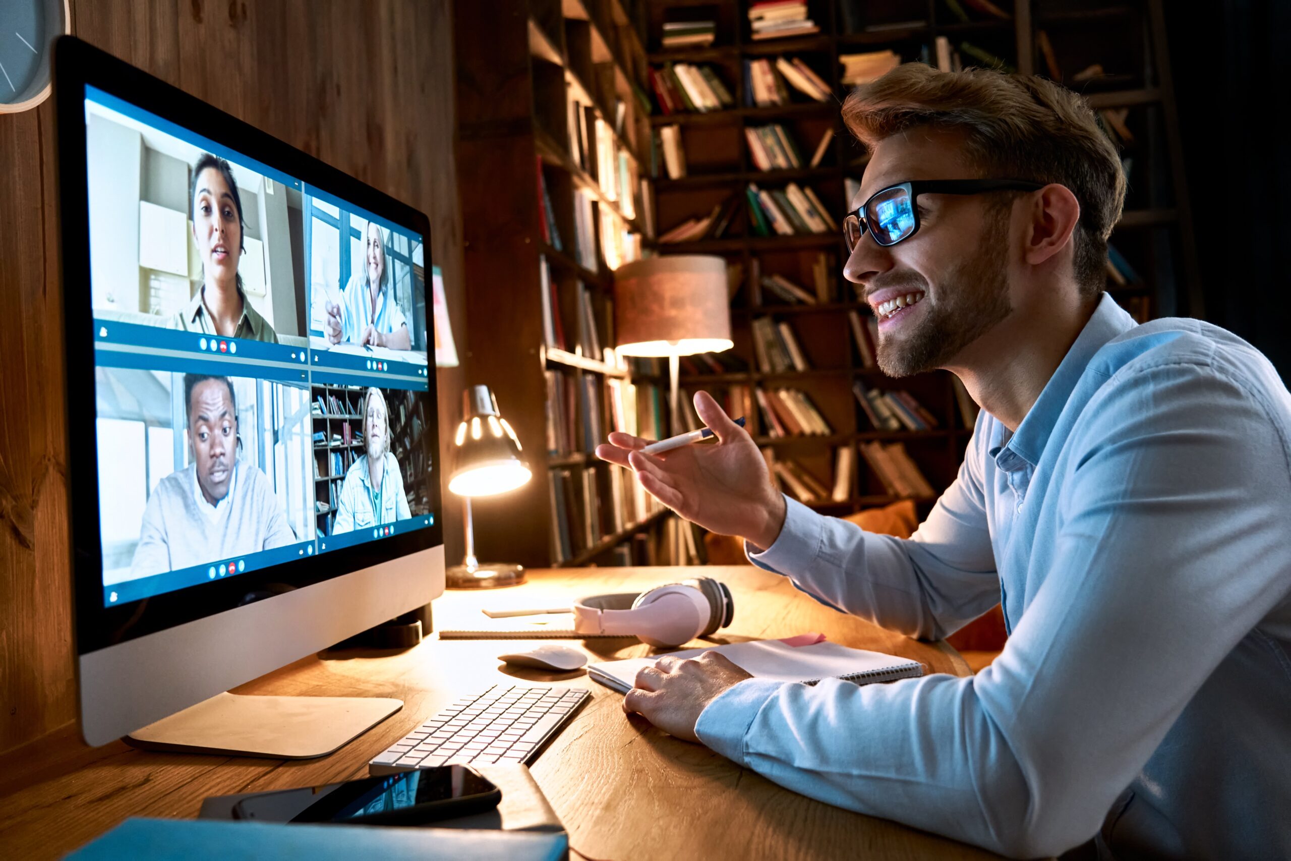 A man participating in a video conference call on his computer